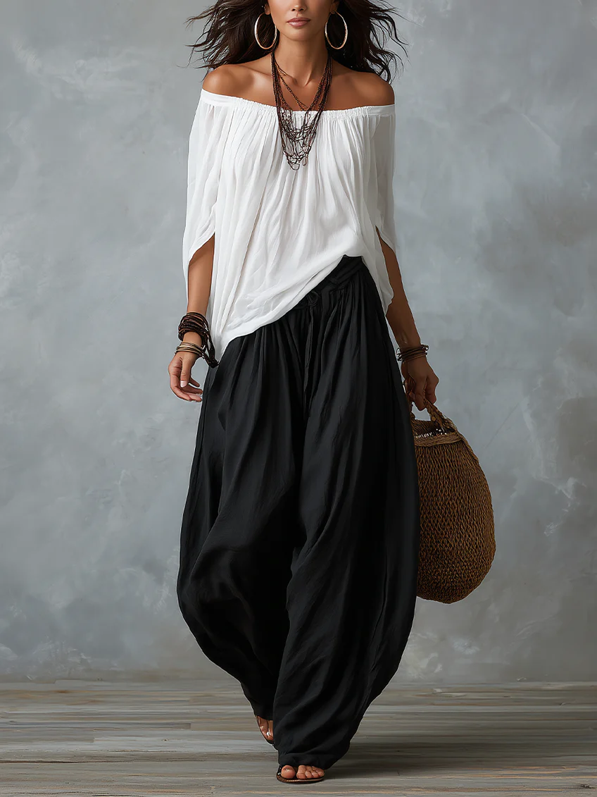 White ensemble with an off-the-shoulder top and lantern-style pants