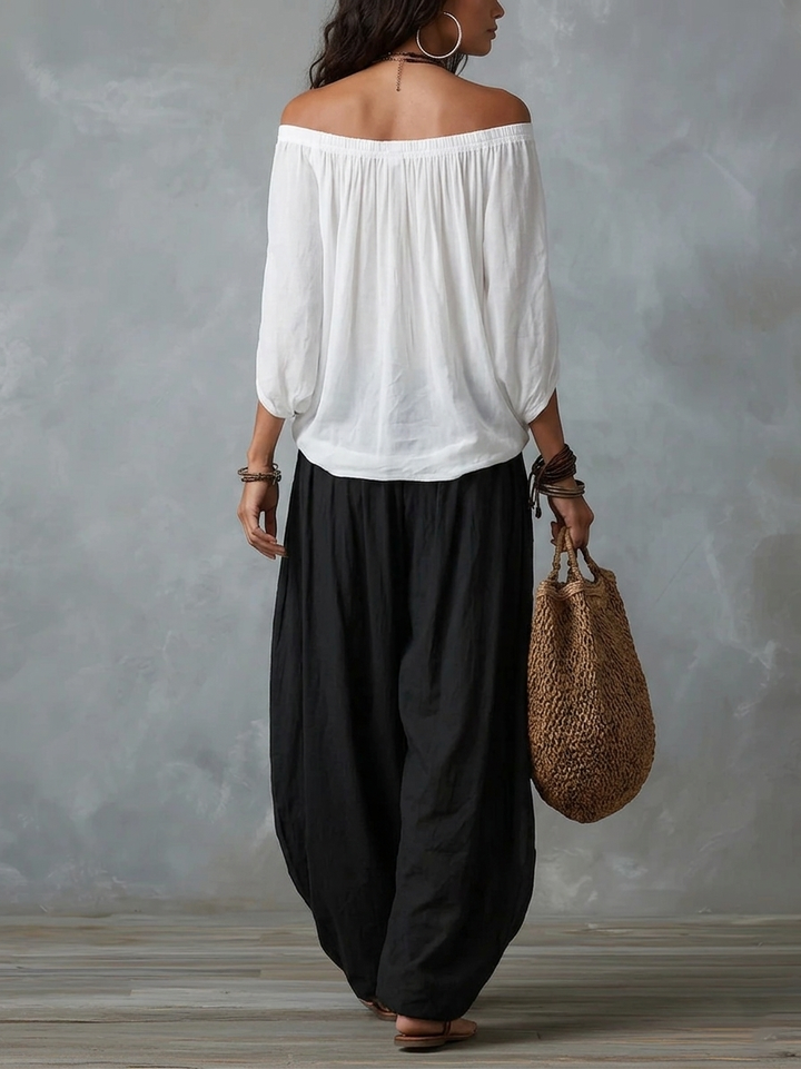 White ensemble with an off-the-shoulder top and lantern-style pants