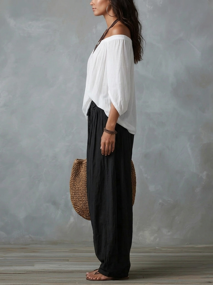 White ensemble with an off-the-shoulder top and lantern-style pants